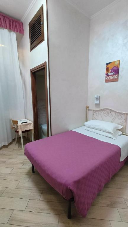Postel nebo postele na pokoji v ubytování Hotel PRINCIPE AMEDEO