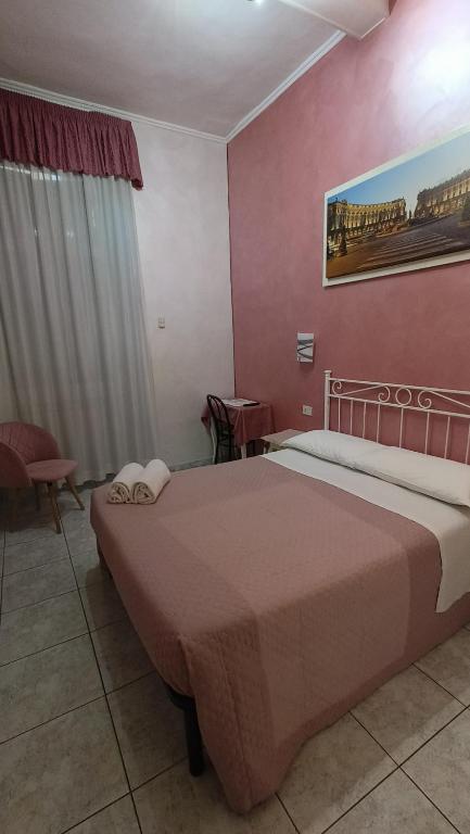 Postel nebo postele na pokoji v ubytování Hotel PRINCIPE AMEDEO