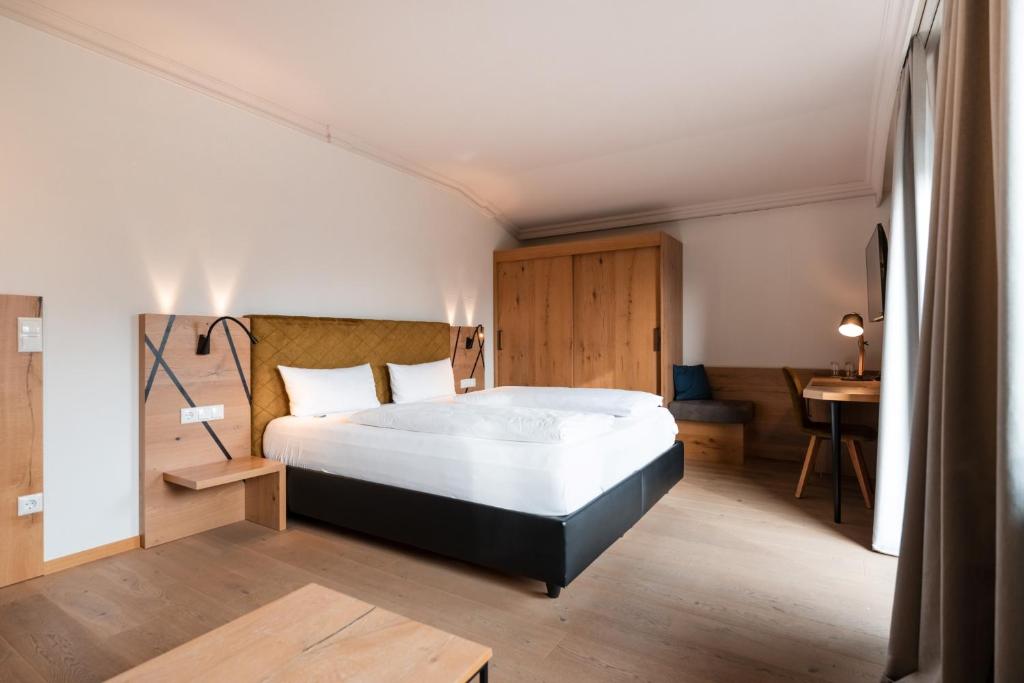 Postel nebo postele na pokoji v ubytování Posthotel Rattenberg