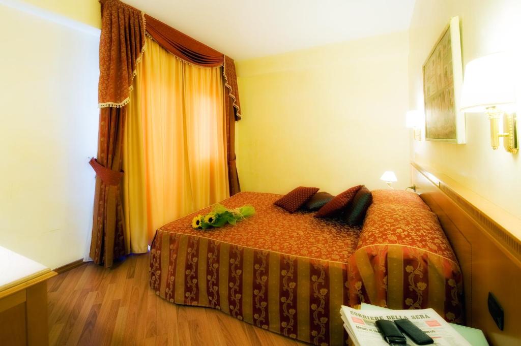 Postel nebo postele na pokoji v ubytování Hotel Bright