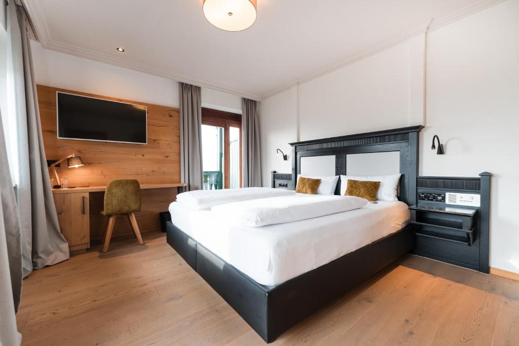Postel nebo postele na pokoji v ubytování Posthotel Rattenberg