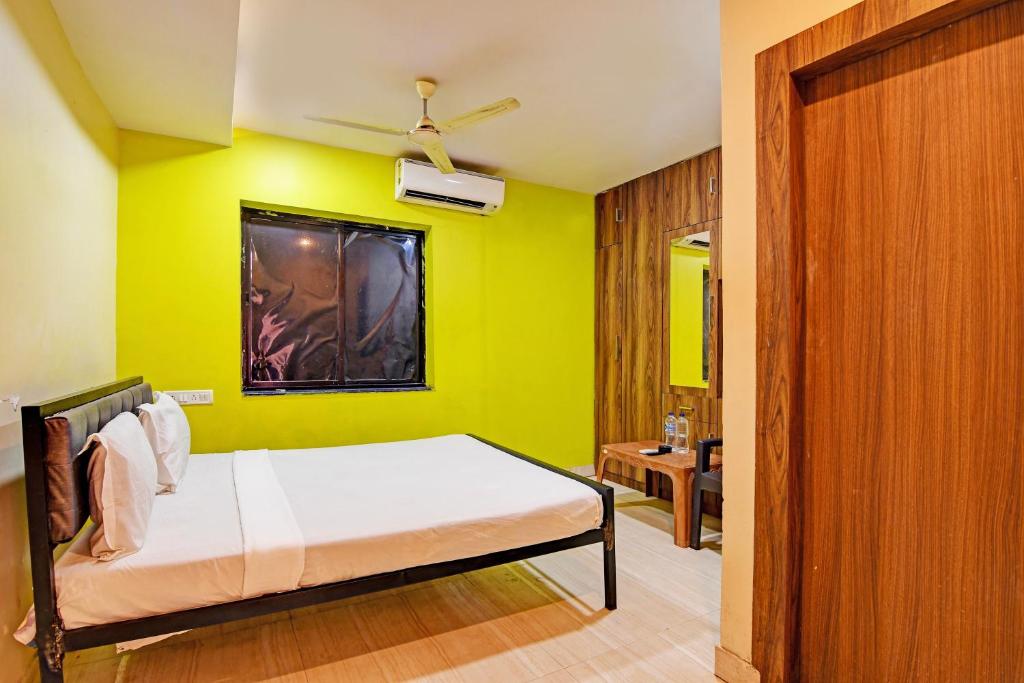 Postel nebo postele na pokoji v ubytování Hotel O NANDAN
