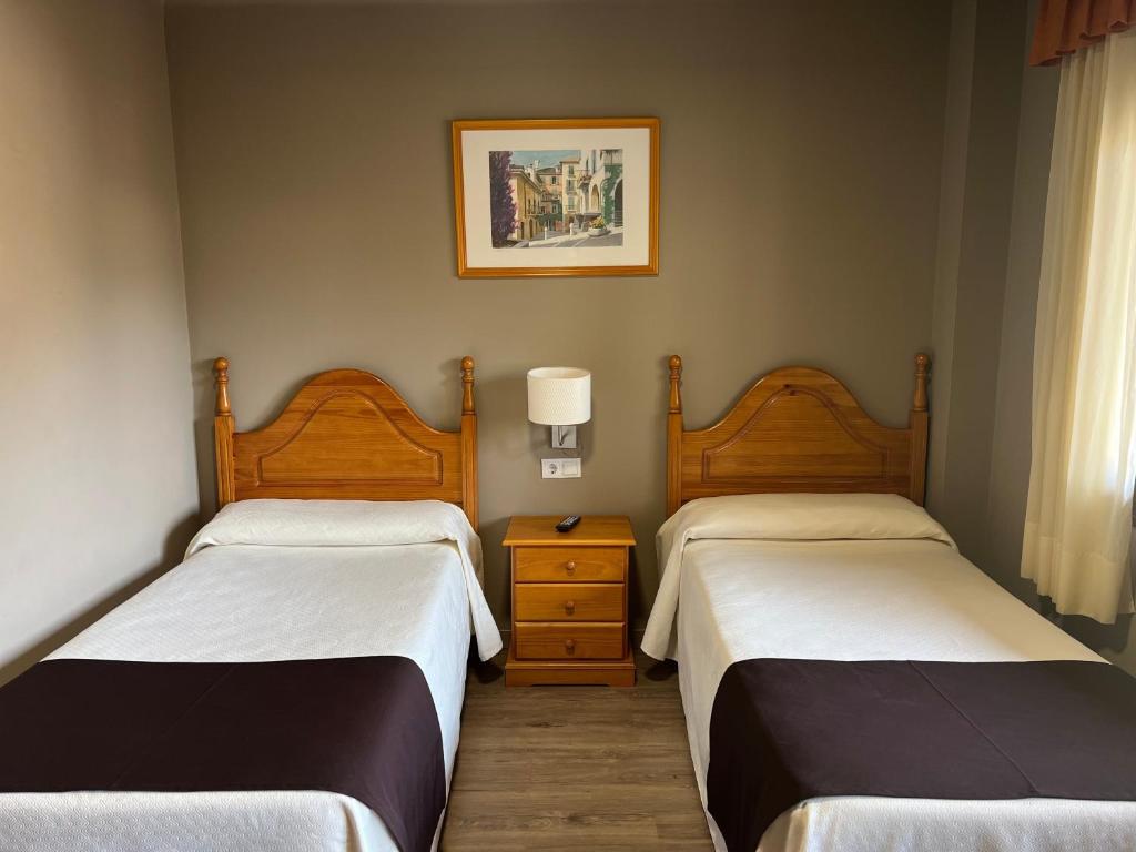 Postel nebo postele na pokoji v ubytování Hotel Juan Canejan