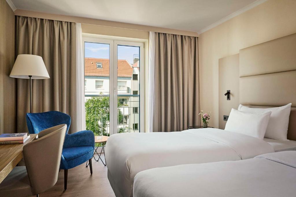 Postel nebo postele na pokoji v ubytování NH Berlin Kurfürstendamm
