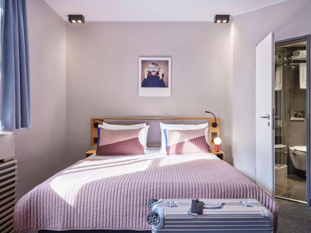 Postel nebo postele na pokoji v ubytování Flemings Hotel Frankfurt-Central