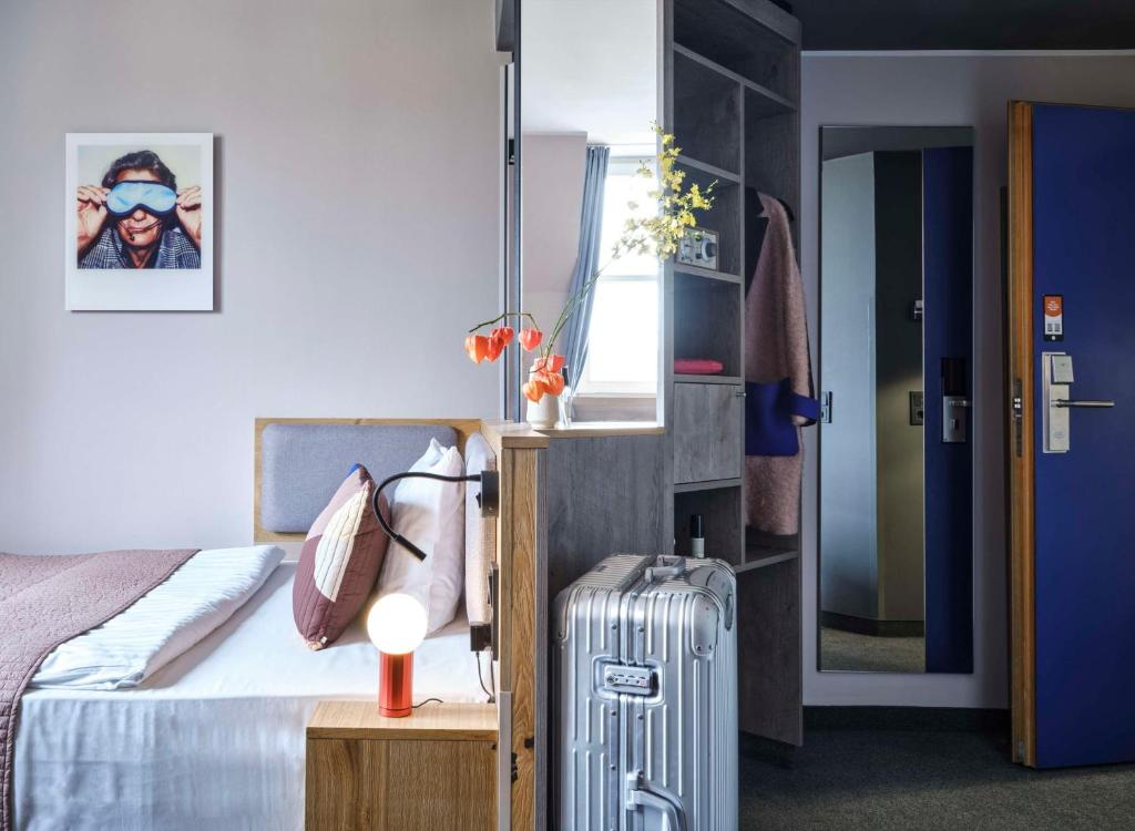 Postel nebo postele na pokoji v ubytování Flemings Hotel Frankfurt-Central