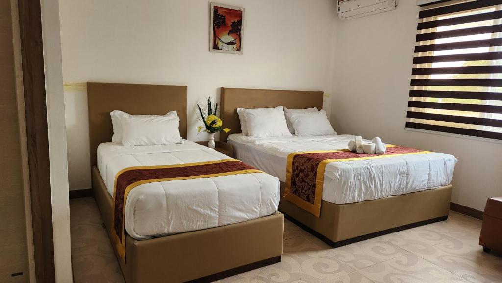 Postel nebo postele na pokoji v ubytování Airport Hotel Clark