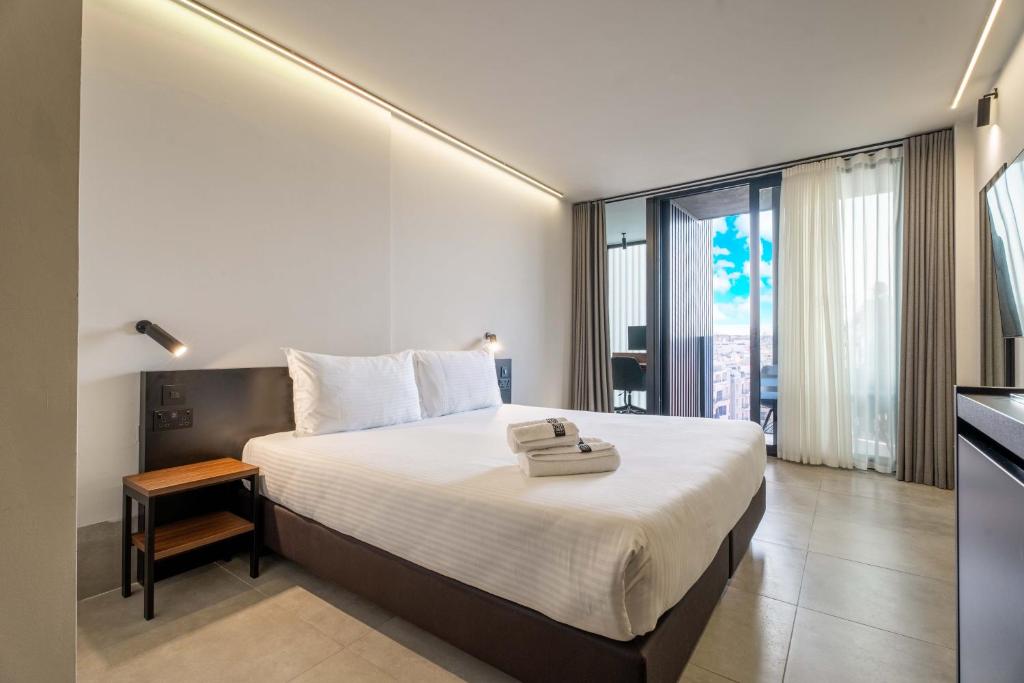 Postel nebo postele na pokoji v ubytování Onyx Hotel