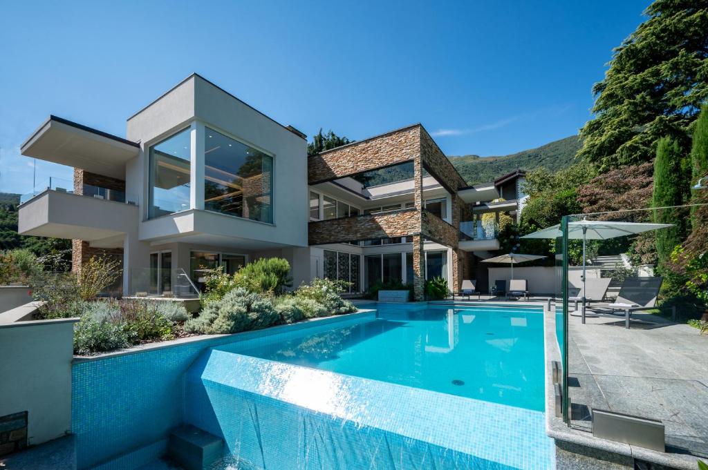 an image of a house with a swimming pool at Villa Koi - where luxury meets serenity in Pianello Del Lario