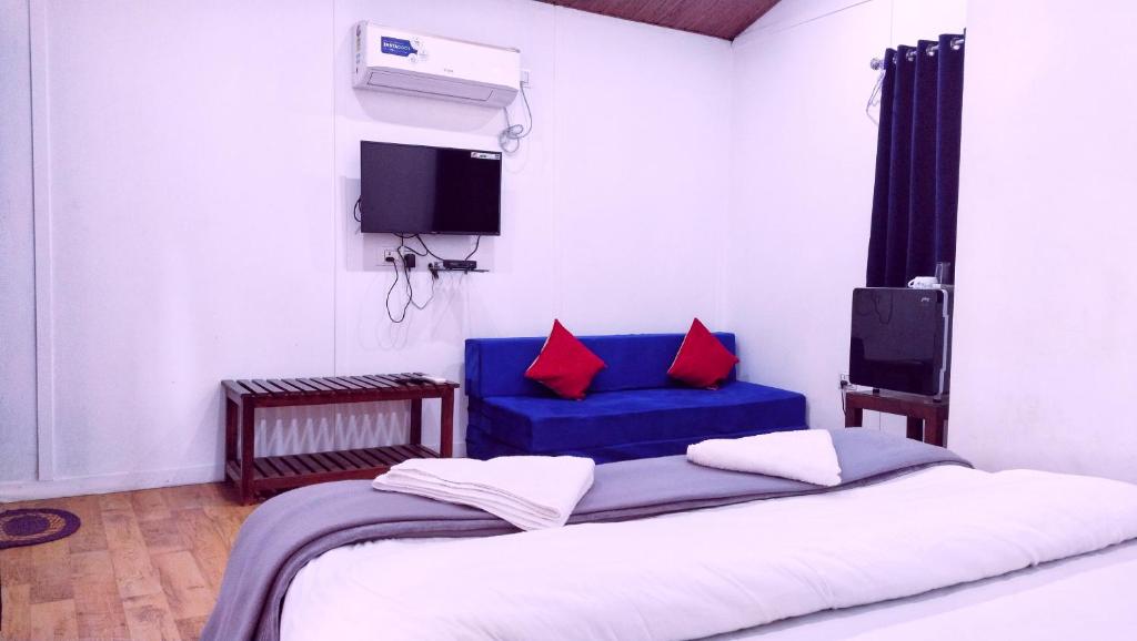 Postel nebo postele na pokoji v ubytování Samant Beach Resort