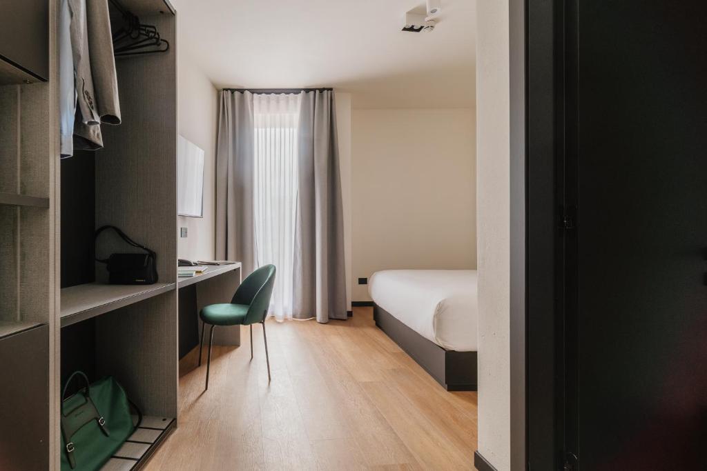 Postel nebo postele na pokoji v ubytování Aspio Hotel
