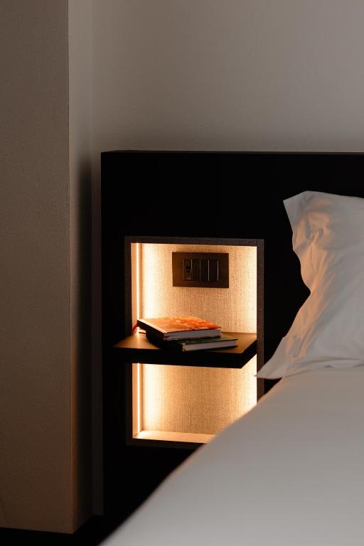 Postel nebo postele na pokoji v ubytování Aspio Hotel