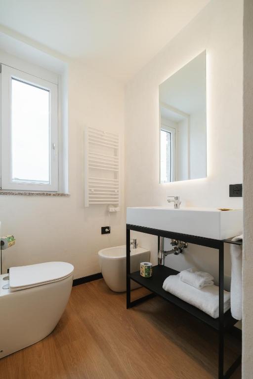 Postel nebo postele na pokoji v ubytování Aspio Hotel