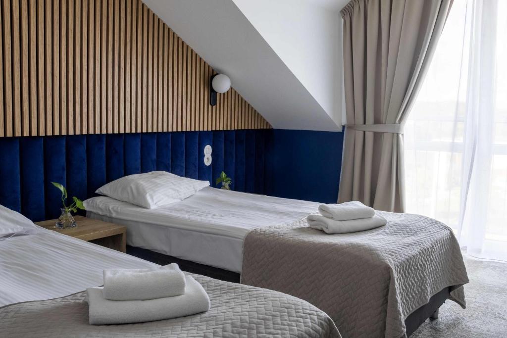 Postel nebo postele na pokoji v ubytování Baltic Hotel