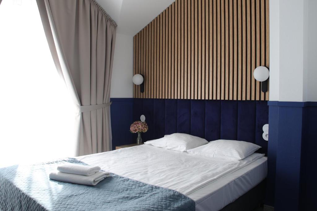 Postel nebo postele na pokoji v ubytování Baltic Hotel