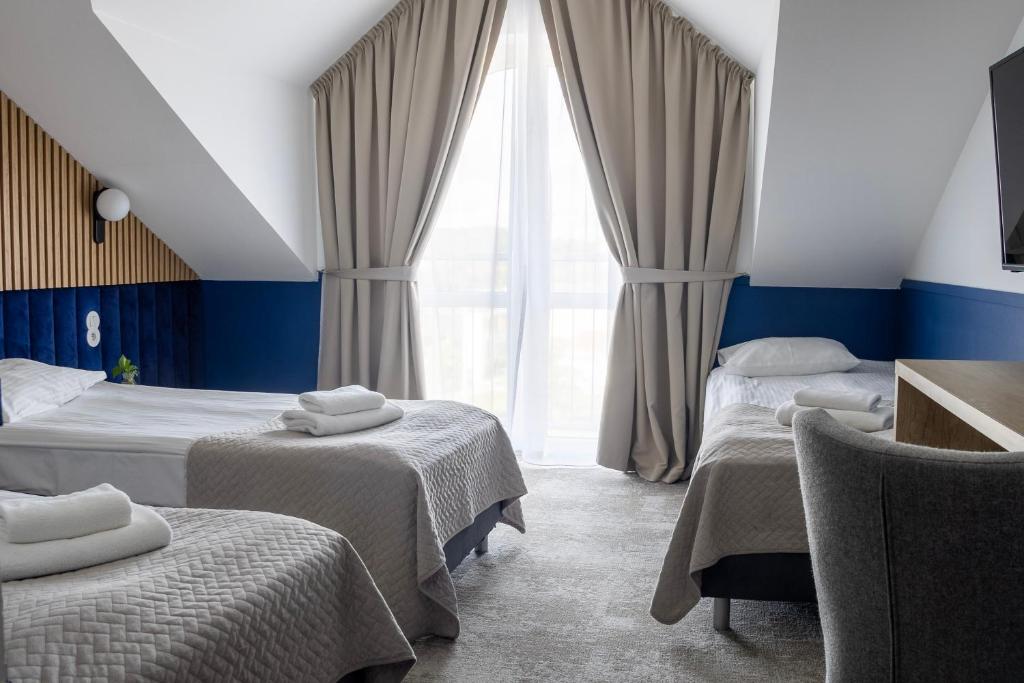 Postel nebo postele na pokoji v ubytování Baltic Hotel