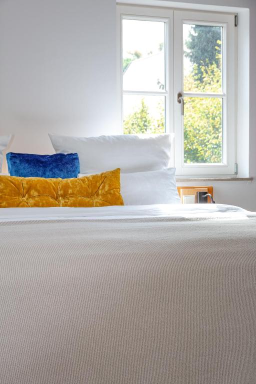 Postel nebo postele na pokoji v ubytování hezelhof hotel