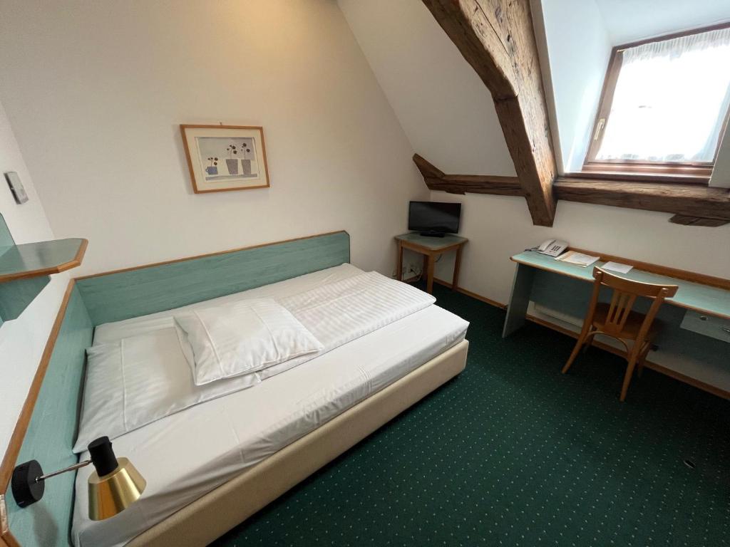 Postel nebo postele na pokoji v ubytování Adalbert Ecohotel