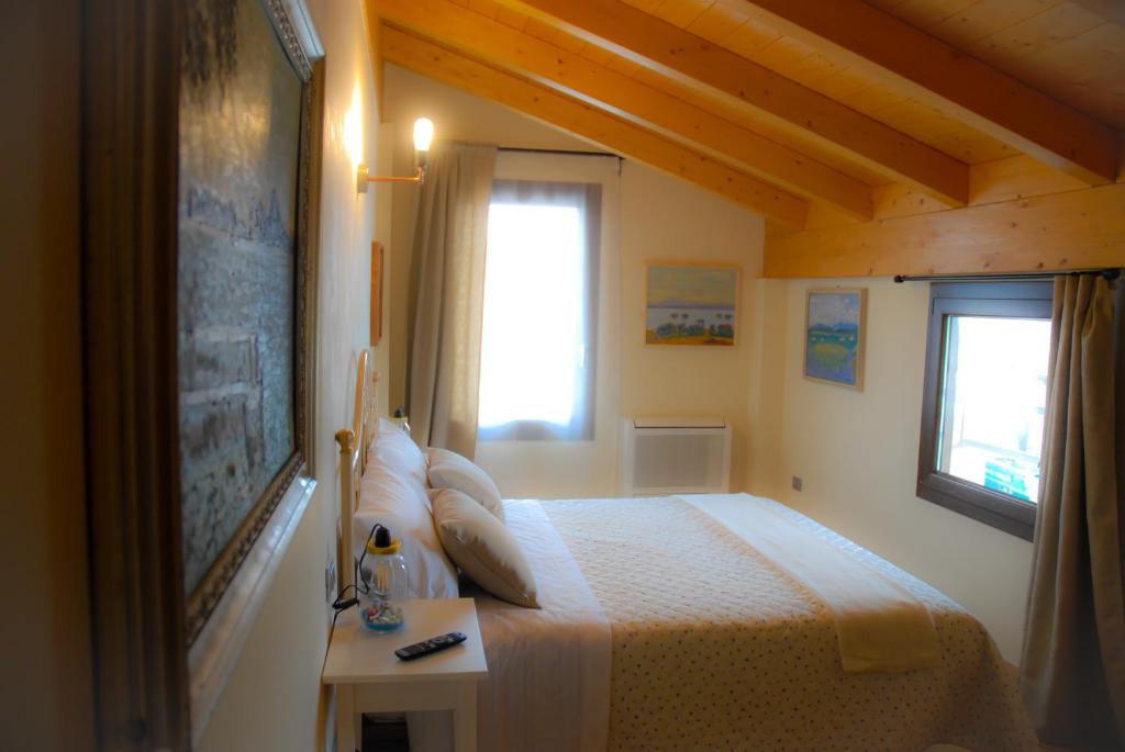 Postel nebo postele na pokoji v ubytování Art Gallery B&B Foresteria
