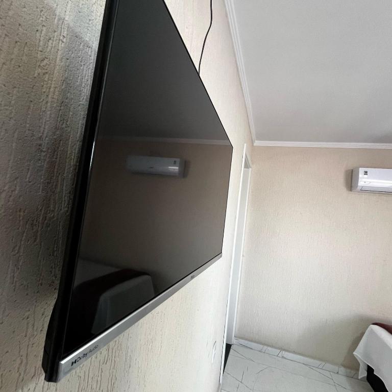 TV a/nebo společenská místnost v ubytování Hotel Aris