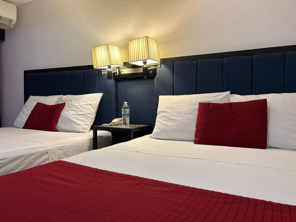 Postel nebo postele na pokoji v ubytování Choco's Hotel