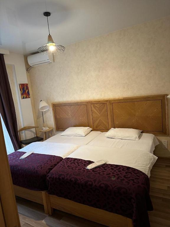 Postel nebo postele na pokoji v ubytování Hotel cozy jano