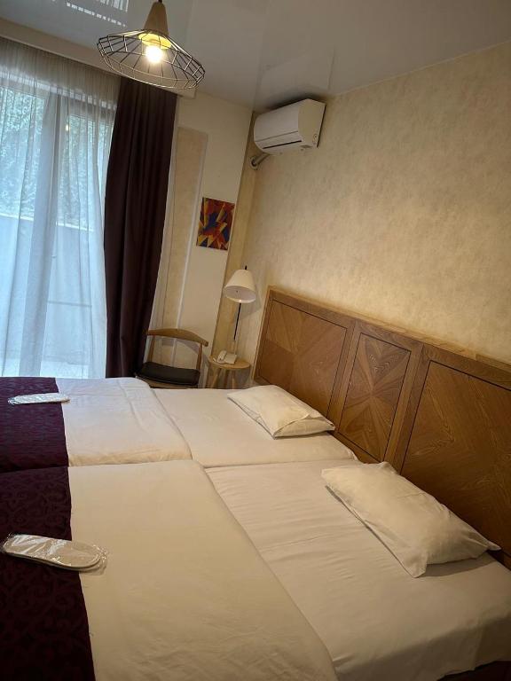 Postel nebo postele na pokoji v ubytování Hotel cozy jano