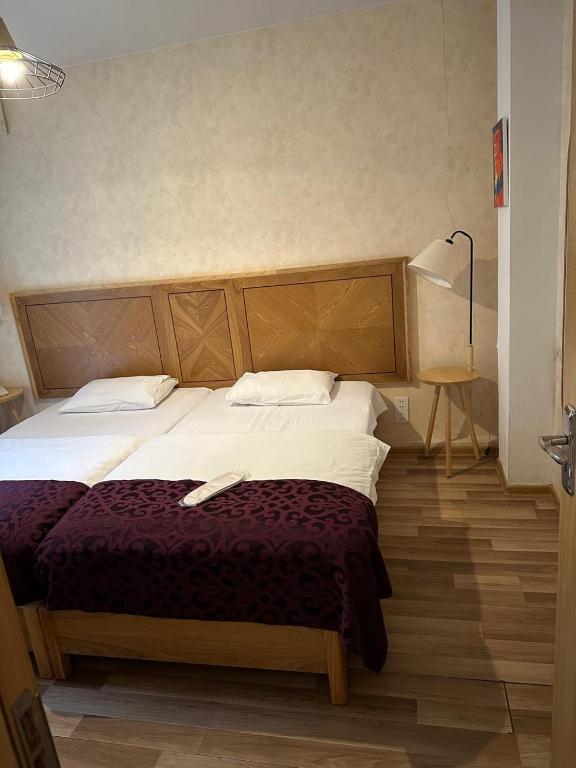 Postel nebo postele na pokoji v ubytování Hotel cozy jano