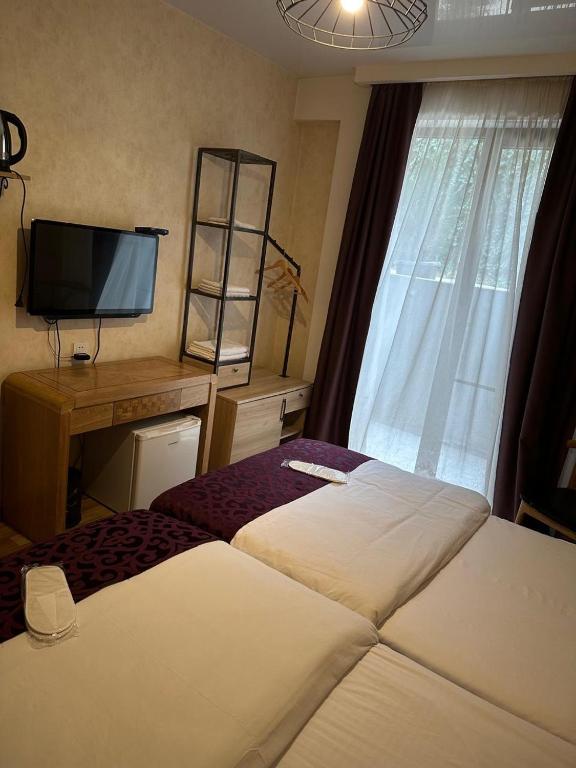 Postel nebo postele na pokoji v ubytování Hotel cozy jano