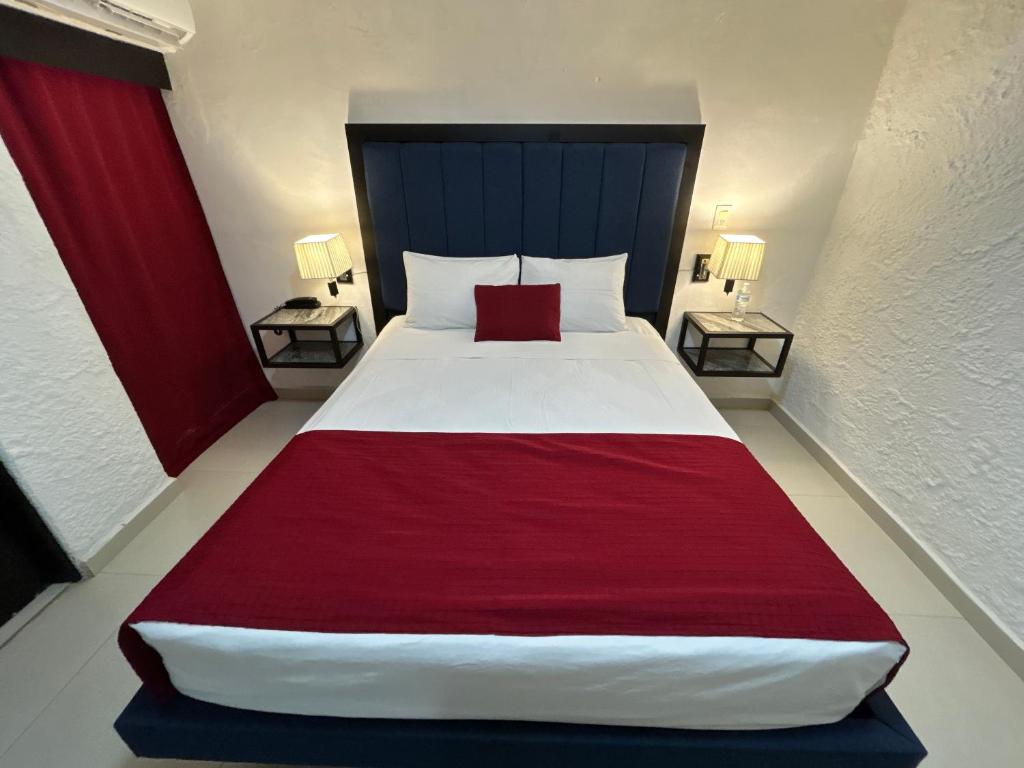 Postel nebo postele na pokoji v ubytování Choco's Hotel