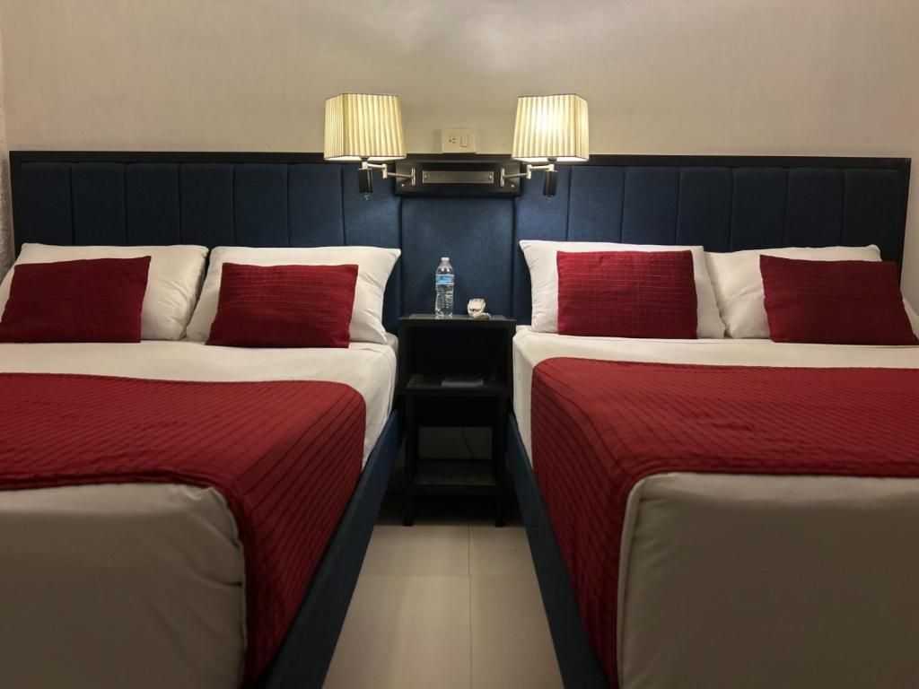 Postel nebo postele na pokoji v ubytování Choco's Hotel