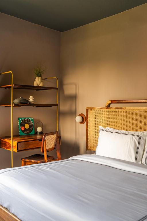 Postel nebo postele na pokoji v ubytování Minimalist Panjim