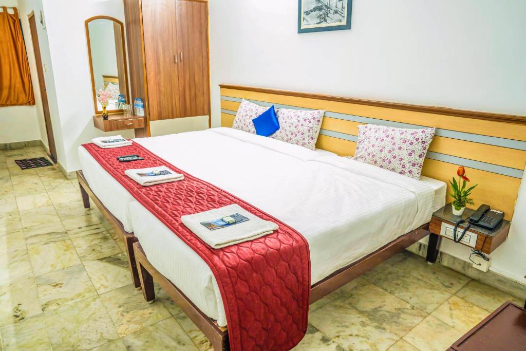 Postel nebo postele na pokoji v ubytování VKG Hotels