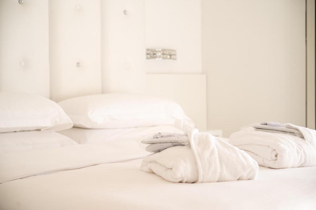 Postel nebo postele na pokoji v ubytování Hotel Savoy