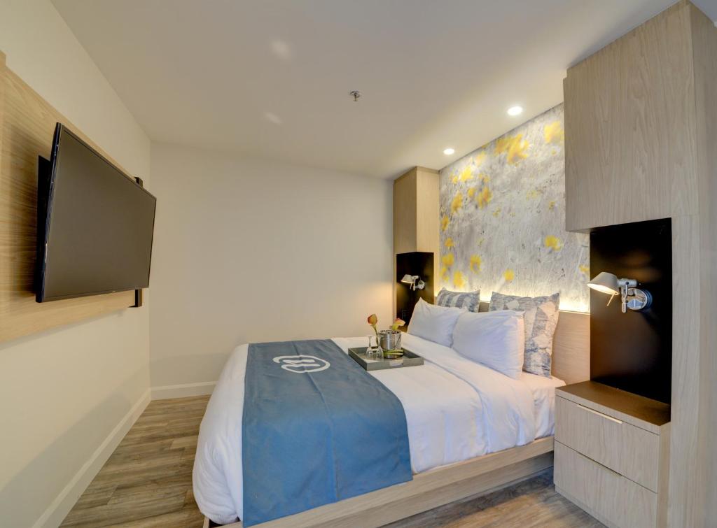 Postel nebo postele na pokoji v ubytování Hôtel Universel, Centre de congrès Rivière-du-Loup