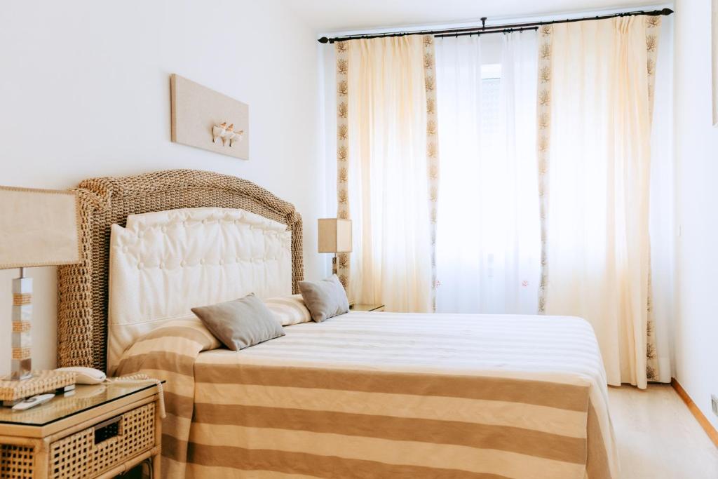 Postel nebo postele na pokoji v ubytování Relais Valle Dell'Idro