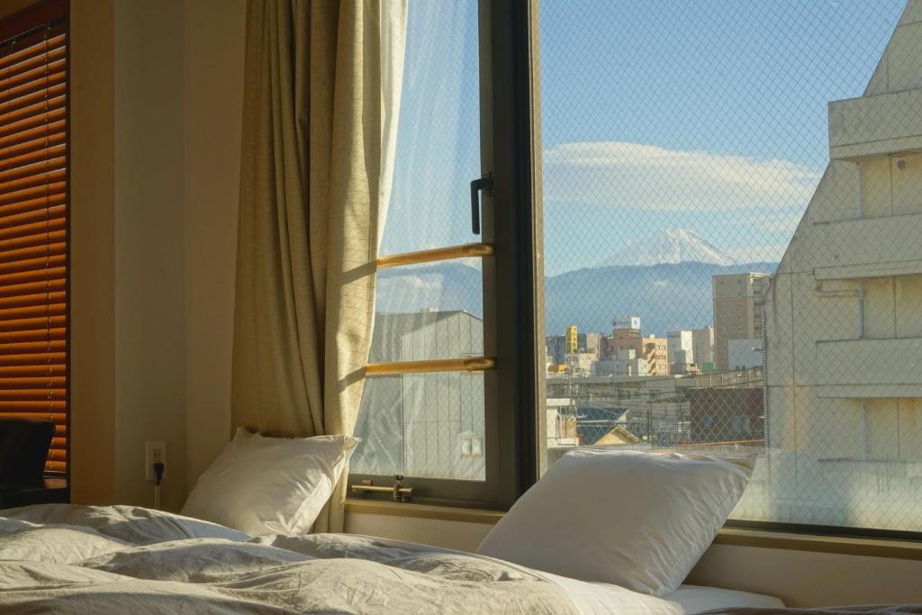 Postel nebo postele na pokoji v ubytování wanderlust STAY