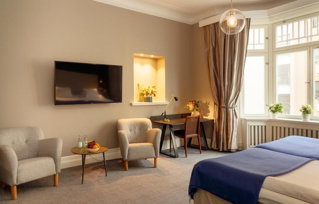 Postel nebo postele na pokoji v ubytování Home Hotel Wellington