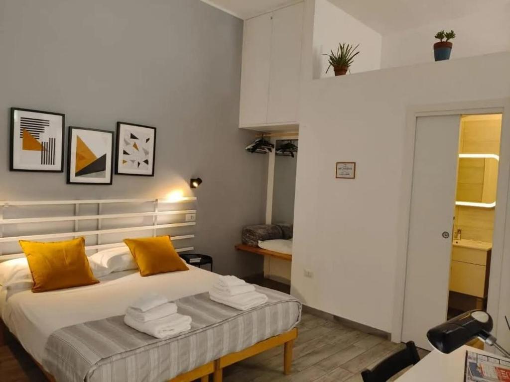 Postel nebo postele na pokoji v ubytování TRANI LA GRAZIA b&b
