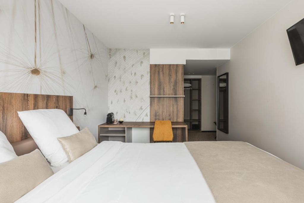 Postel nebo postele na pokoji v ubytování Hotel Amfora