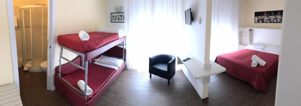 Łóżko lub łóżka w pokoju w obiekcie Hotel Perla Verde