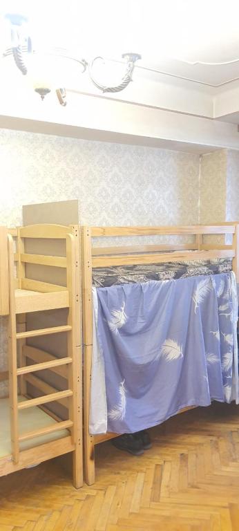 Postel nebo postele na pokoji v ubytování Crown Hostel
