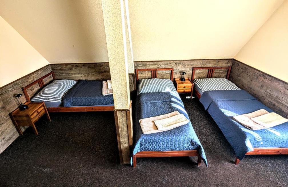 Postel nebo postele na pokoji v ubytování Hotel Alfa
