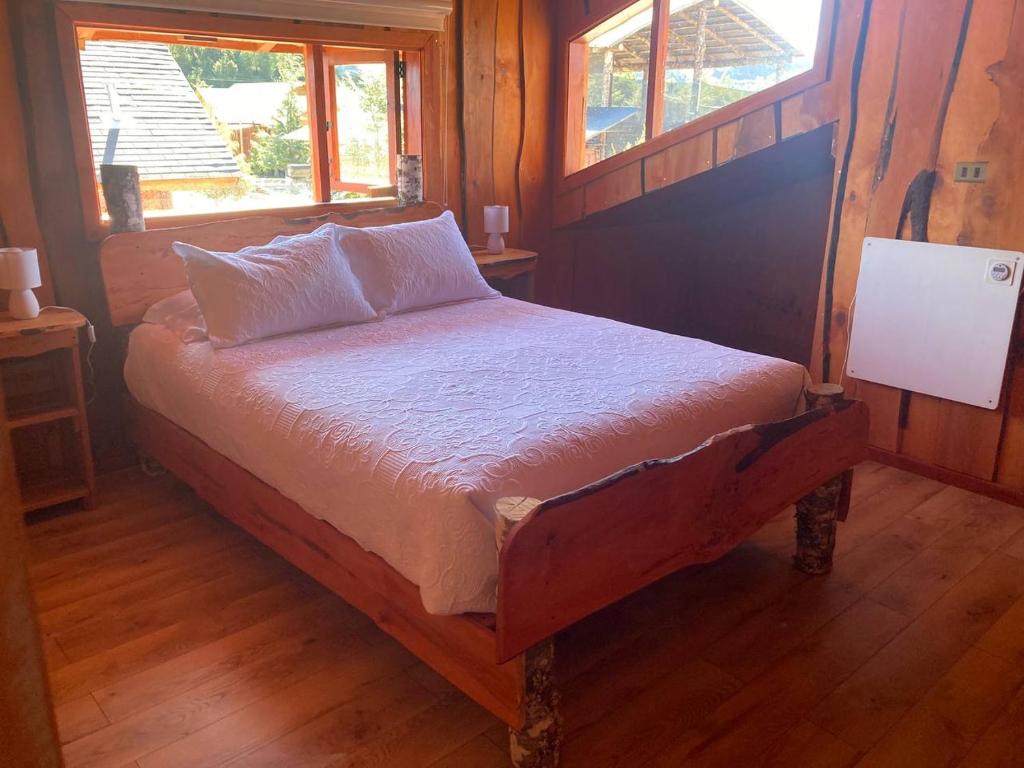Postel nebo postele na pokoji v ubytování Kumewe Lodge & Cabañas