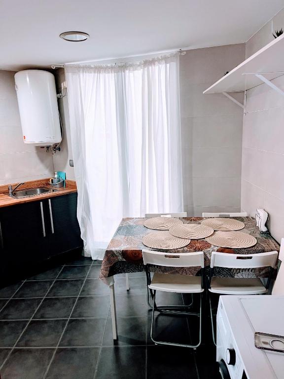 Kuchyň nebo kuchyňský kout v ubytování Confort y relax centro