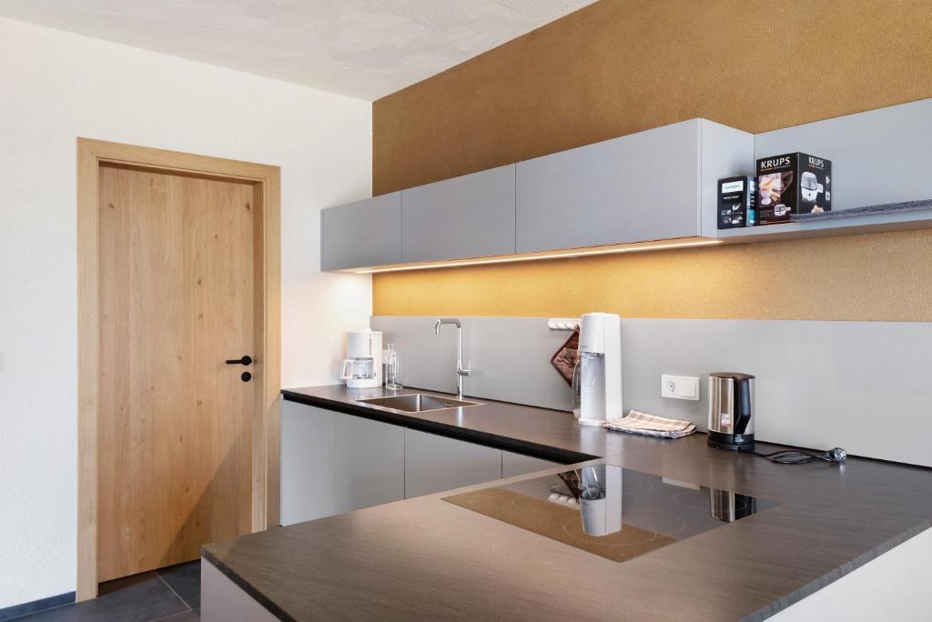 Kuchyňa alebo kuchynka v ubytovaní Ratscheinerhof App Gipfelglück
