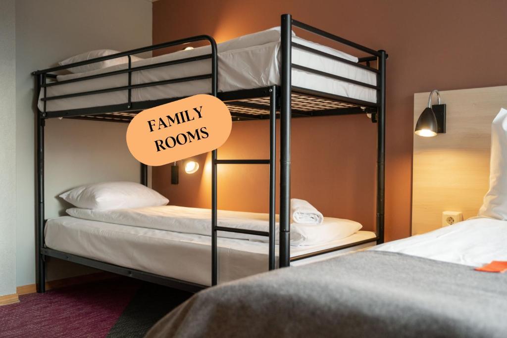 two bunk beds with a sign that reads family rooms at Citybox Oslo in Oslo