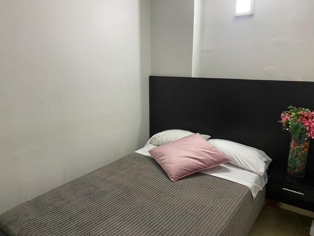Postel nebo postele na pokoji v ubytování Destino Nómada Calle 11 n 1-38