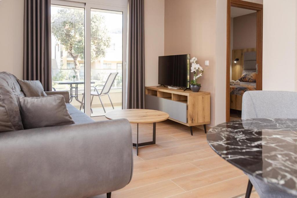 TV a/nebo společenská místnost v ubytování Apartments Posejdon