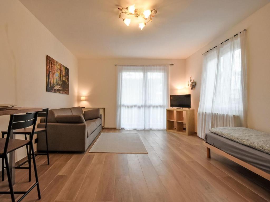 a living room with a couch and a table at Studio San Anton by Interhome in Bormio